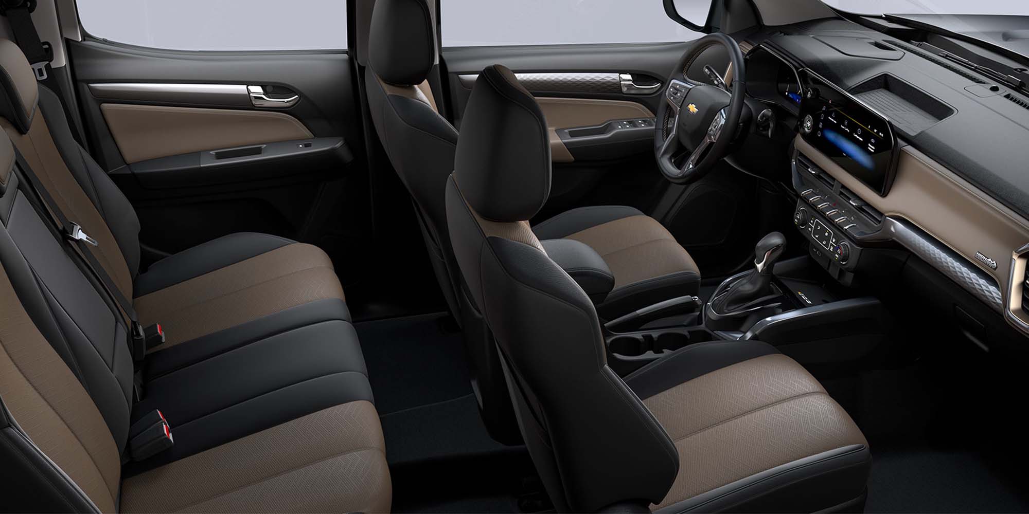 Interior de la Chevrolet Colorado con coginería en negro y café, volante y panel frontal